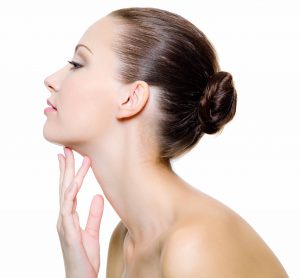 Model with Hair Bun Touching Fingers Under Chin Omega 3 Gorgeous