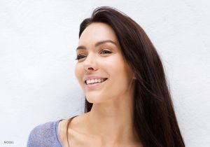 Headshot of Woman with Dark Brown Hair a Sculpted Nose Looking to the Side Headshot of Woman with Dark Brown Hair a Sculpted Nose Looking to the Side